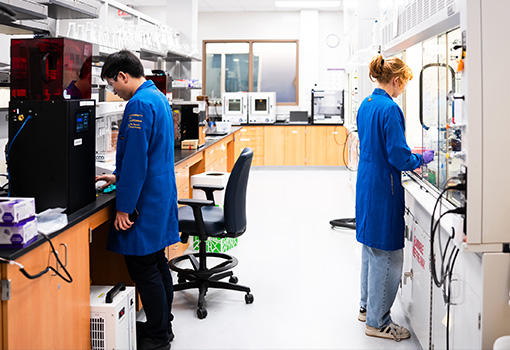 mage of two UCSB researchers working inside a laboratory at the OASIS facility.