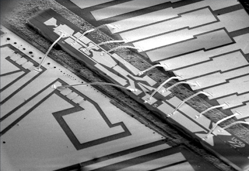 Magnified image of a microchip produced at the UCSB Nanofabrication facility before it has been packaged